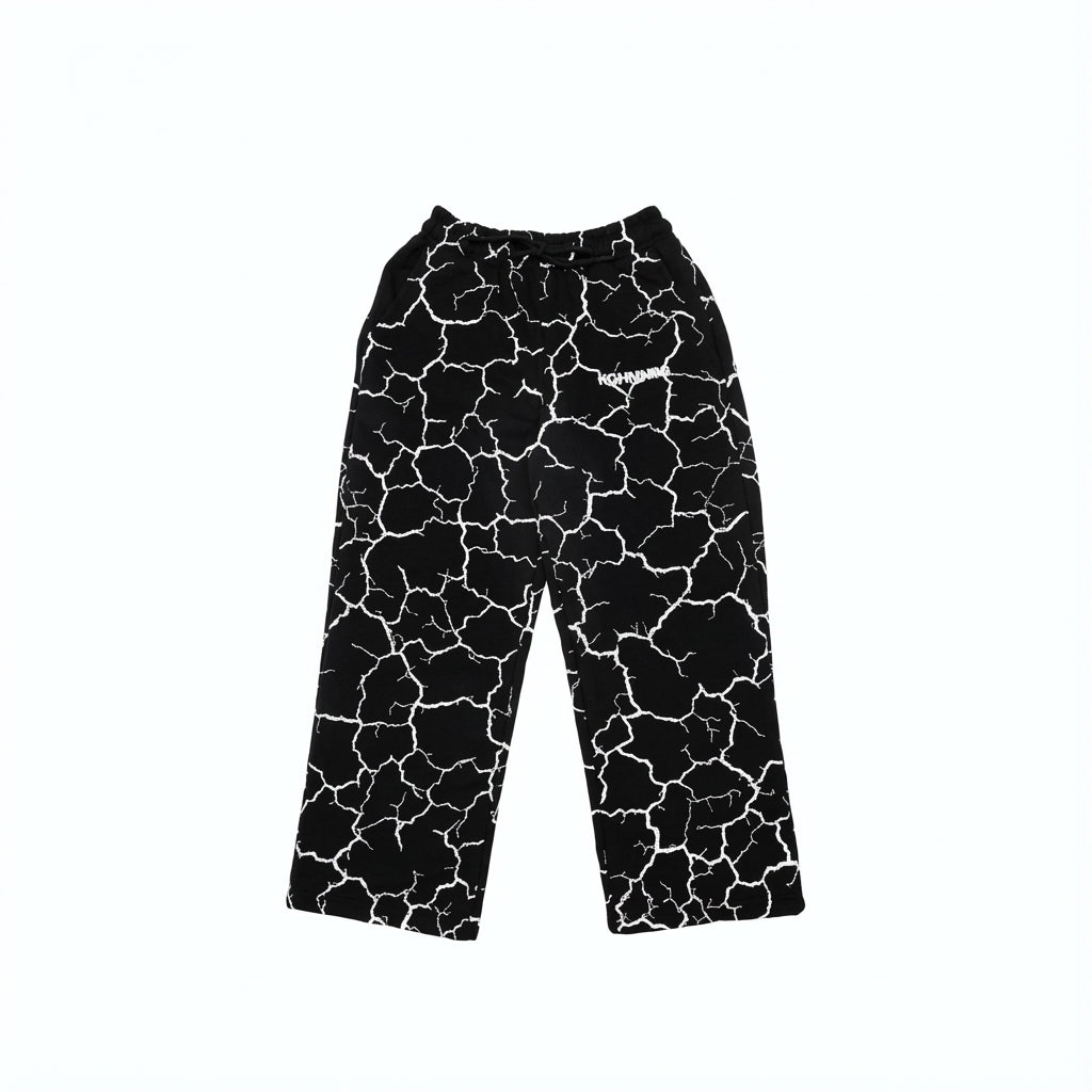 Black drawstring pants with white lightning bolt print and logo.